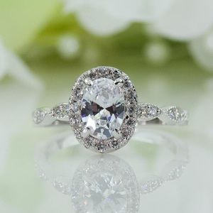 1.00 Ct. Halo Art Deco Oval Cubic Zirconia Engagement Ring In Sterling Silver